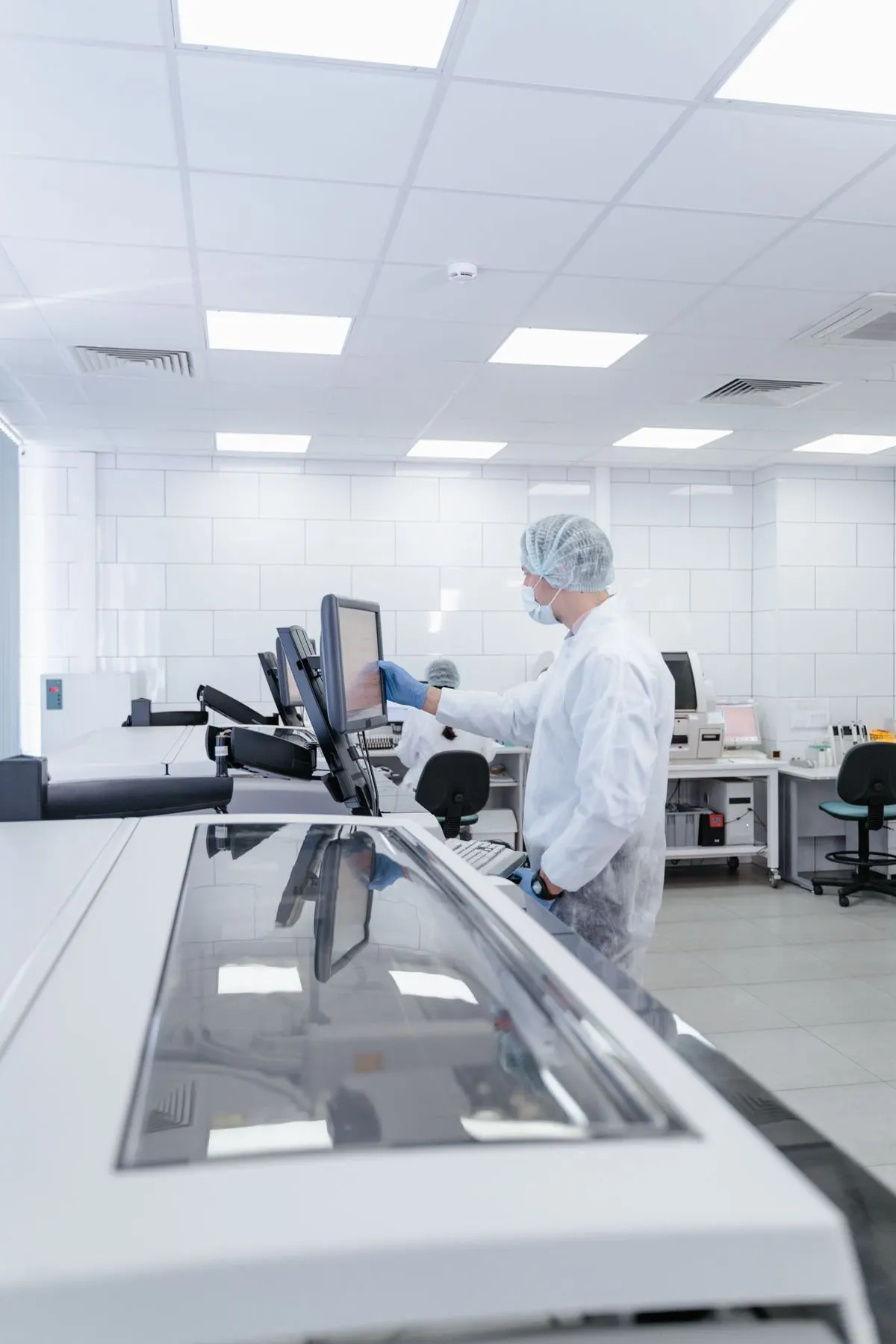 Technician monitoring readings during a cleanroom qualification test