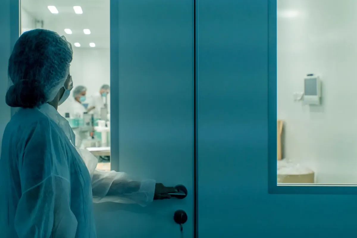Technician testing a biosafety cabinet in a controlled laboratory environment
