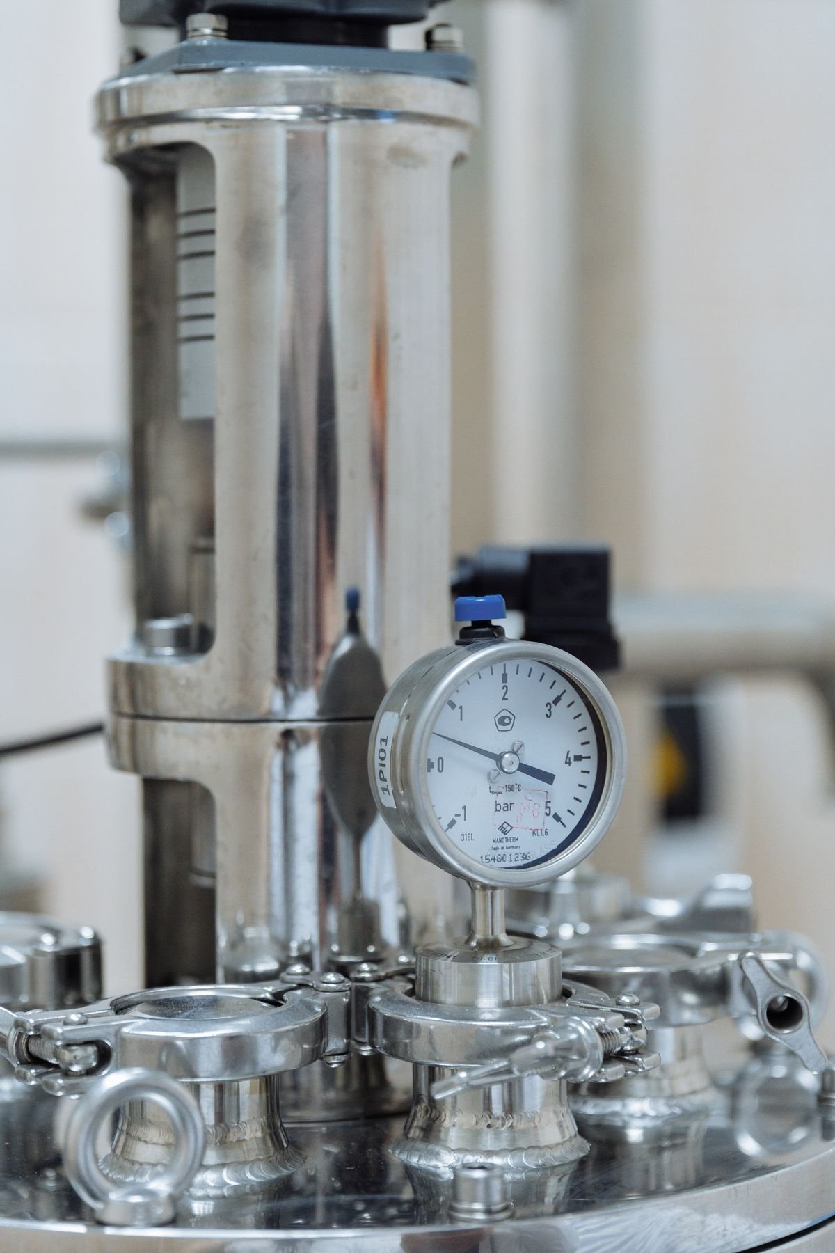 Laboratory pressure gauge being calibrated